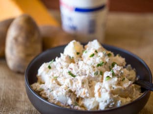 Loaded Baked Potato Salad is cheesy, creamy and ready in just minutes. It makes the perfect side dish to your holiday meal or potluck!