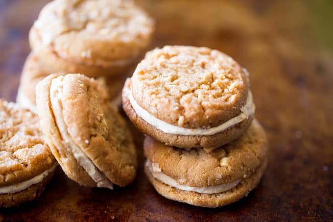 Peanut Butter Do-si-dos Cookie Sandwiches are a Girl Scouts favorite made with peanut butter and oatmeal are sandwiched together with a fluffy soft peanut butter buttercream filling.