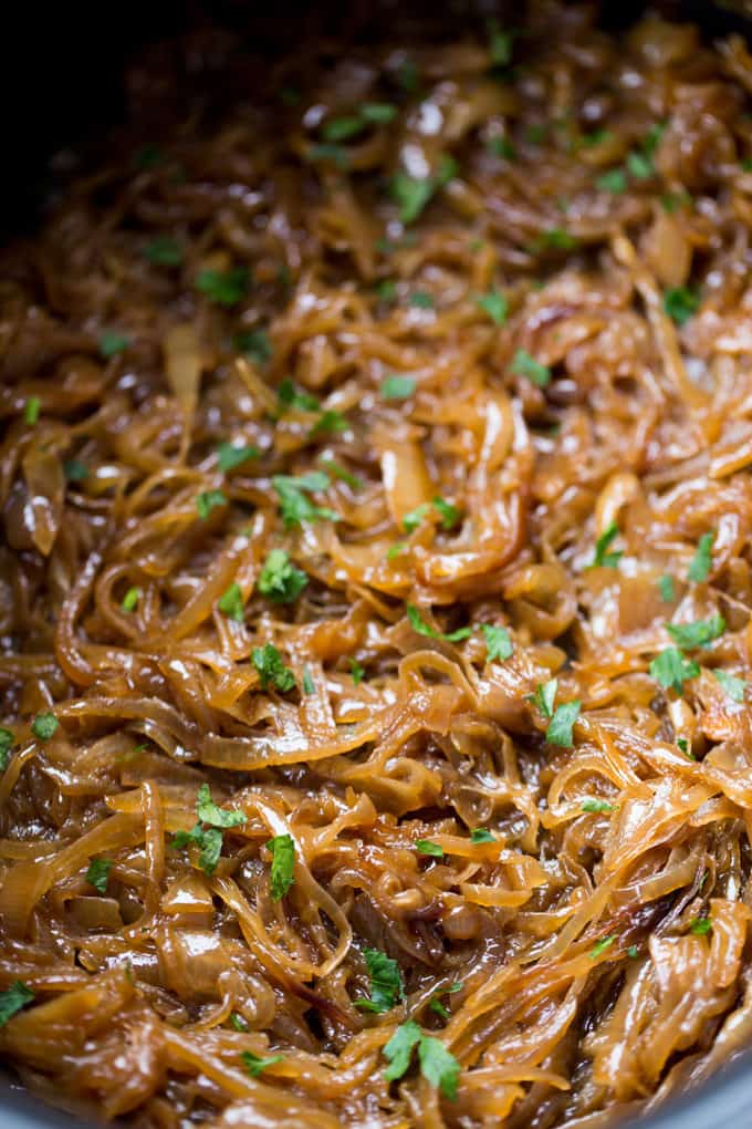 Crock pot full of Slow Cooker Caramelized Onions 