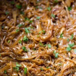 Slow Cooker Caramelized Onions with no babysitting a pan and constantly stirring! Just onions, butter and brown sugar cook until meltingly sweet.