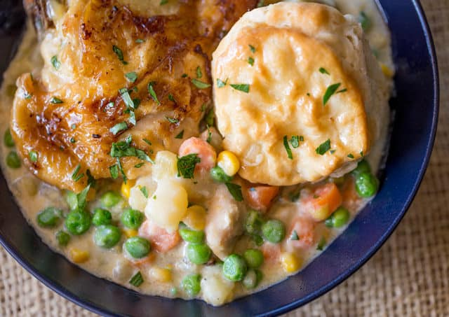 bowl of chicken Pot Pie with crispy chicken thighs and vegetables