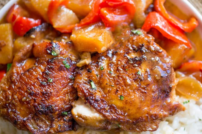 Slow Cooker Hawaiian Pineapple Chicken with crispy chicken thighs, fresh pineapple chunks, onions and bell pepper takes 15 minutes of prep and makes the perfect meal to come home to after a long workday!