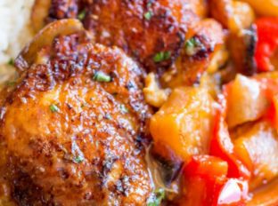 Slow Cooker Hawaiian Pineapple Chicken with crispy chicken thighs, fresh pineapple chunks, onions and bell pepper takes 15 minutes of prep and makes the perfect meal to come home to after a long workday!