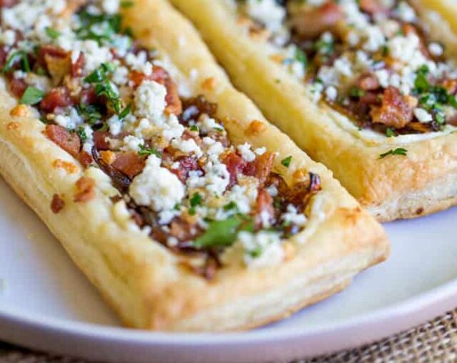 two Bacon Blue Cheese Caramelized Onion Tarts on plate