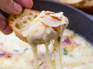 Baked Fontina Cheese Dip inspired by Ina Garten with garlic and thyme amped up with the addition of fresh mozzarella and Parmesan is the perfect appetizer.