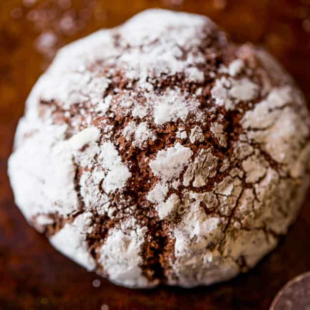 Dark Chocolate Crinkle Cookies are a holiday classic made with cocoa powder and melted dark chocolate are the chewiest and fudgiest cookies you'll make for your Christmas exchange this year!