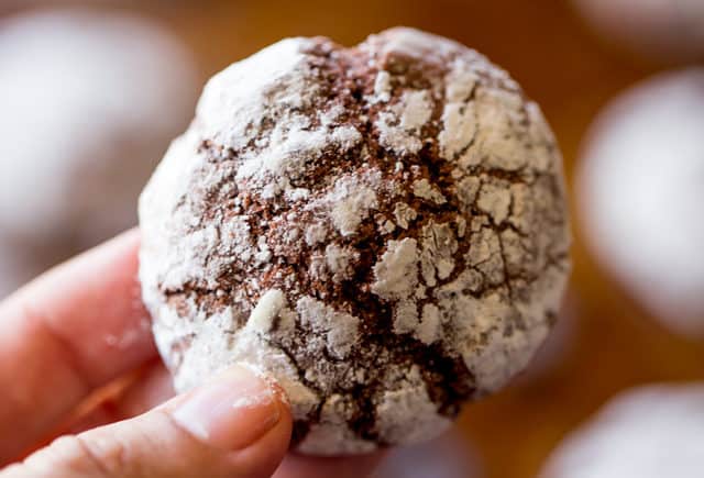 hand holding Dark Chocolate Crinkle Cookies