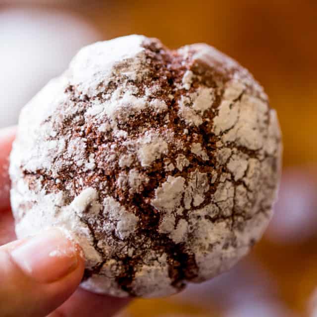 Dark Chocolate Crinkle Cookies are a holiday classic made with cocoa powder and melted dark chocolate are the chewiest and fudgiest cookies you'll make for your Christmas exchange this year!