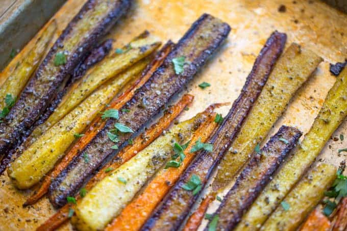 Garlic Butter Roasted Carrots with a touch of canola oil, cracked black pepper and Kosher salt makes the perfect side dish for a weeknight meal or a holiday crowd.