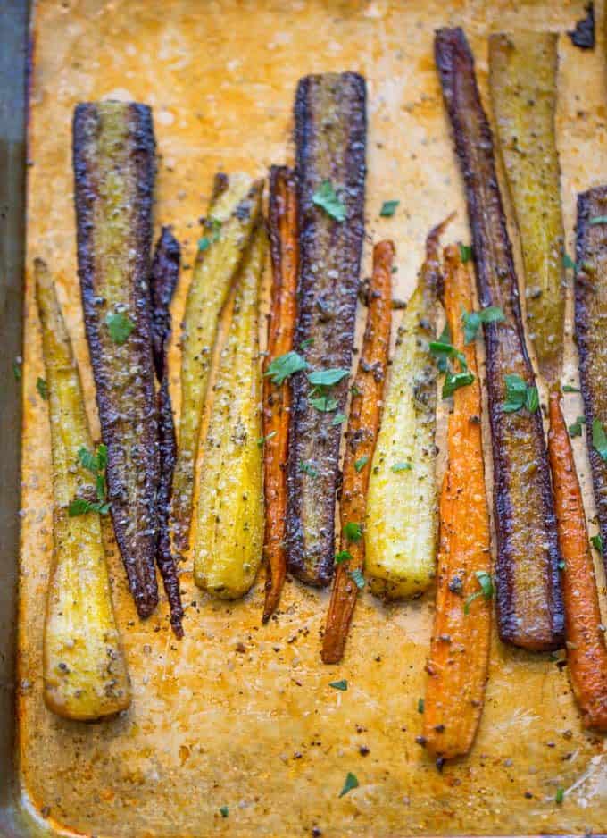 Garlic Butter Roasted Carrots with a touch of canola oil, cracked black pepper and Kosher salt makes the perfect side dish for a weeknight meal or a holiday crowd.