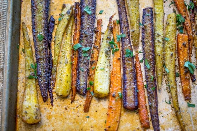 Garlic Butter Roasted Carrots with a touch of canola oil, cracked black pepper and Kosher salt makes the perfect side dish for a weeknight meal or a holiday crowd.