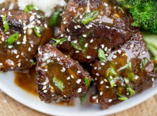 Slow Cooker Korean Short Ribs browned and cooked until fork tender with just a few minutes of prep work and all your favorite flavors.