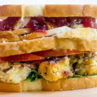 sandwich with layers of turkey, stuffing, veggies and gravy