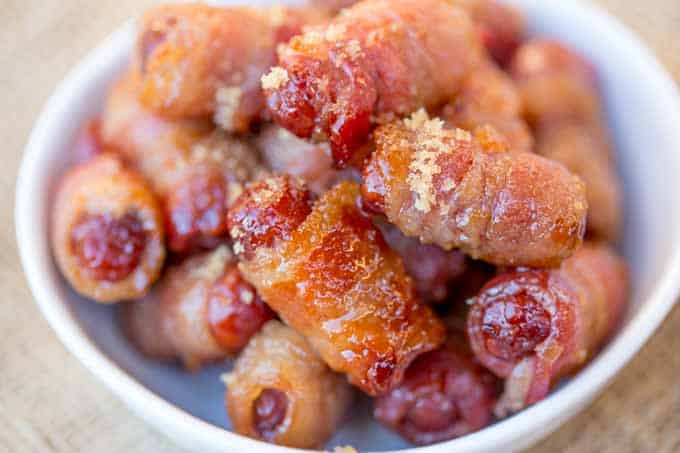 Bacon Brown Sugar Smokies are the quintessential party food that everyone fights over even though they're so easy to make! Just three ingredients plus I have five flavor add-in options for you!