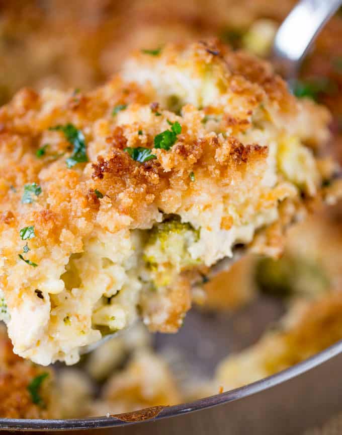 chicken broccoli casserole with rice on serving spoon