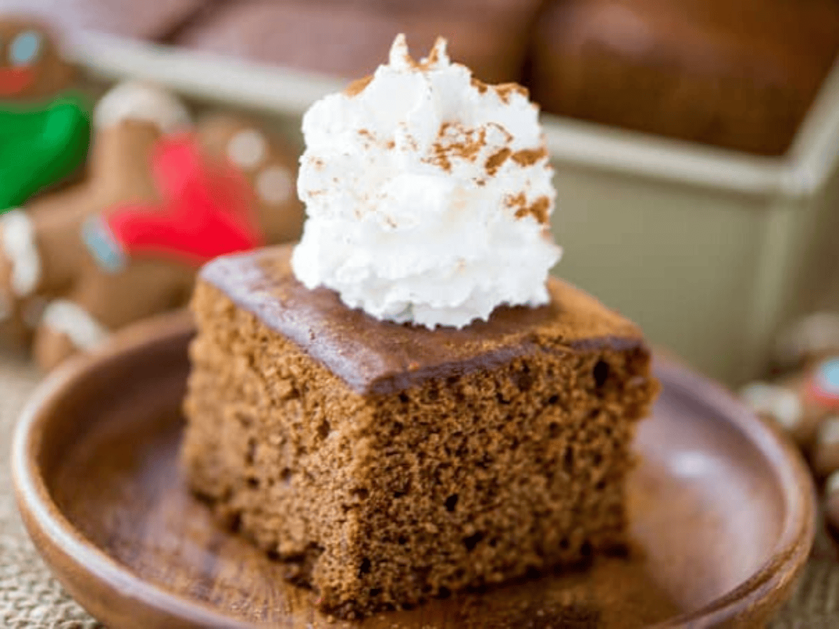 Close up of cake on plate with whipped cream on top
