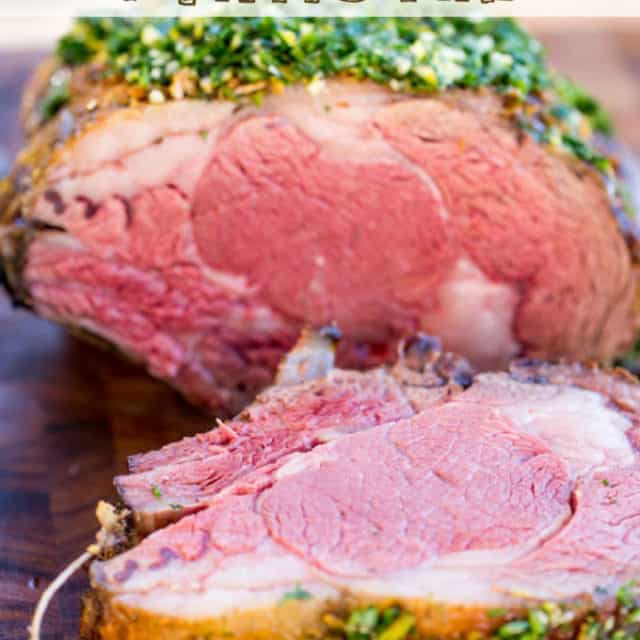 Perfect Garlic Prime Rib made with a garlic, thyme and rosemary crust is gorgeously browned on the outside and a perfect medium on the inside. Topped of with a gremolata it is the perfect show-stopping holiday/event meal!