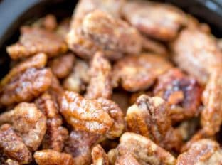 Slow Cooker Candied Cinnamon Pecans are a total breeze to make and will leave your house smelling absolutely delicious! Plus they double as amazing holiday gifts you can make in bulk!