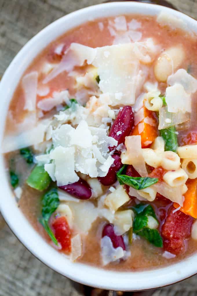 Slow Cooker Minestrone Soup topped with grated Parmesan
