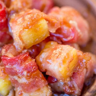 Spicy Sweet Bacon Wrapped Pineapple Bites caramelized with brown sugar and hot sauce make a perfect sticky, sweet, spicy, fruity bacon bite your guest will love in just minutes!