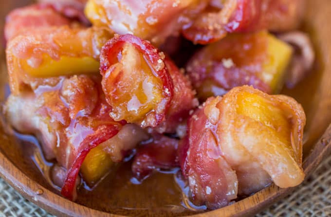 Spicy Sweet Bacon Wrapped Pineapple Bites caramelized with brown sugar and hot sauce make a perfect sticky, sweet, spicy, fruity bacon bite your guest will love in just minutes!