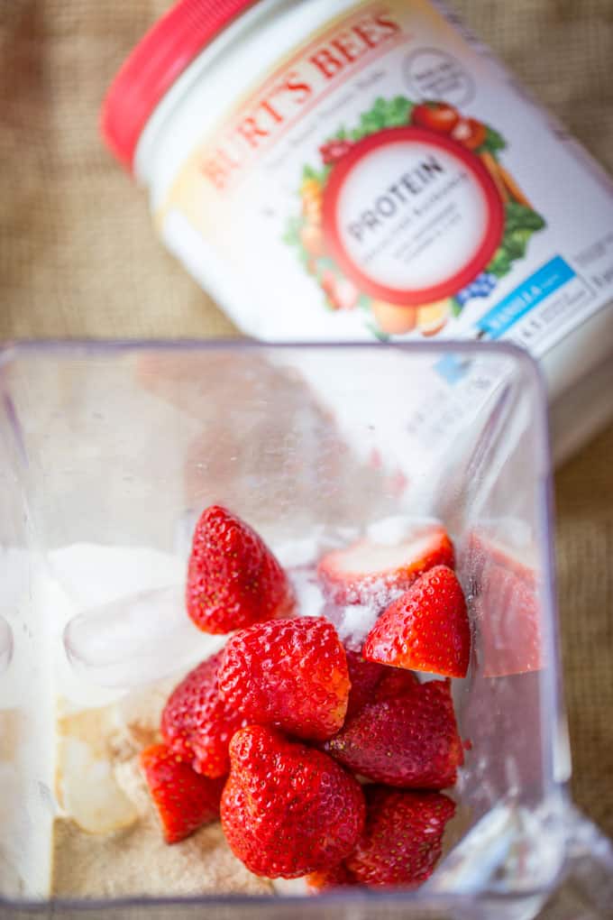 Strawberry Shortcake Smoothie made with Burt’s Bees Vanilla Protein Shake powder makes the most amazing cake-y healthy smoothie you'll want to help shake up healthier eating. 