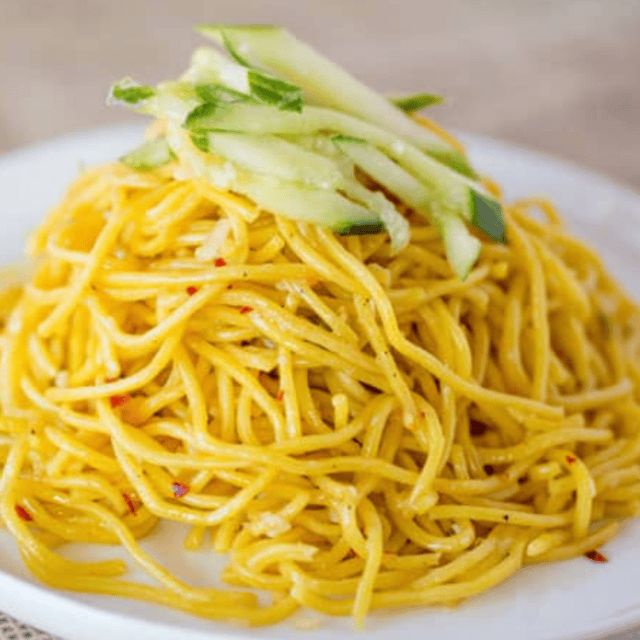 Noodles served on plate and garnished