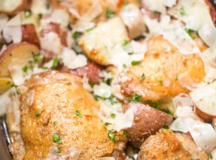 Slow Cooker Garlic Parmesan Chicken and Potatoes takes just a few minutes of prep and five ingredients. Crisp chicken thighs, buttery red potatoes and shaved Parmesan cheese make the perfect easy weeknight meal.