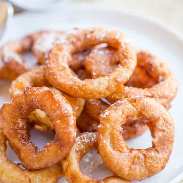 Apple Fritter Rings made with a pancake batter without yeast come together in just a few minutes and are the perfect sweet treat to end a meal or breakfast for kids who love donuts.