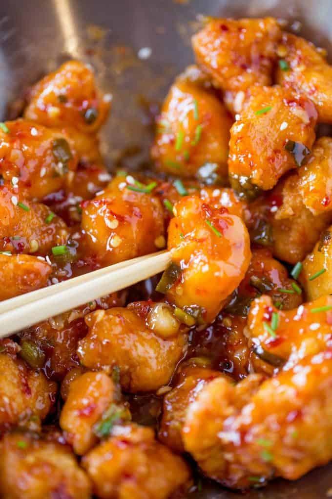 Asian chicken in a bowl with chopstick