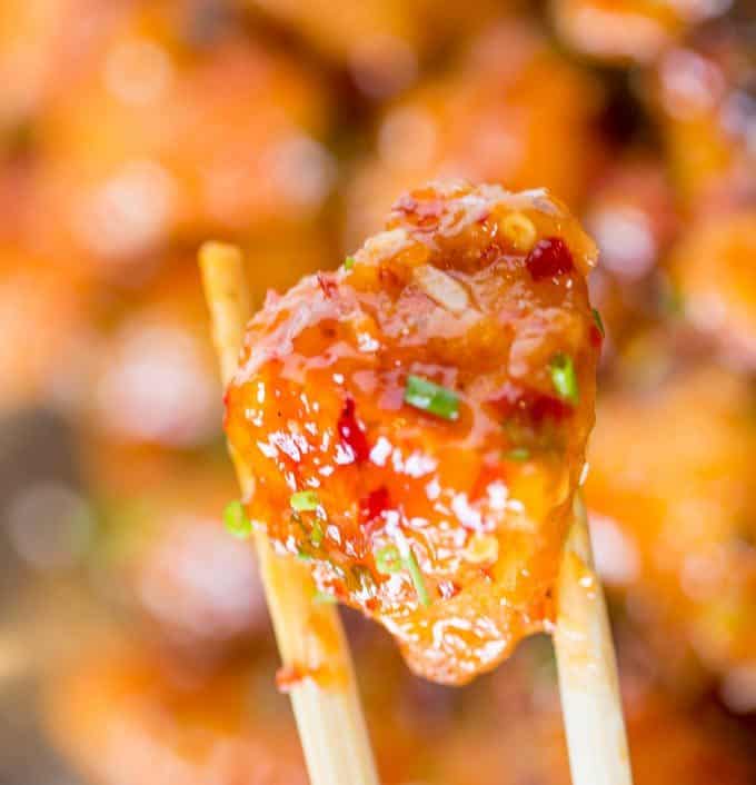 crispy chicken piece pinched in chopsticks