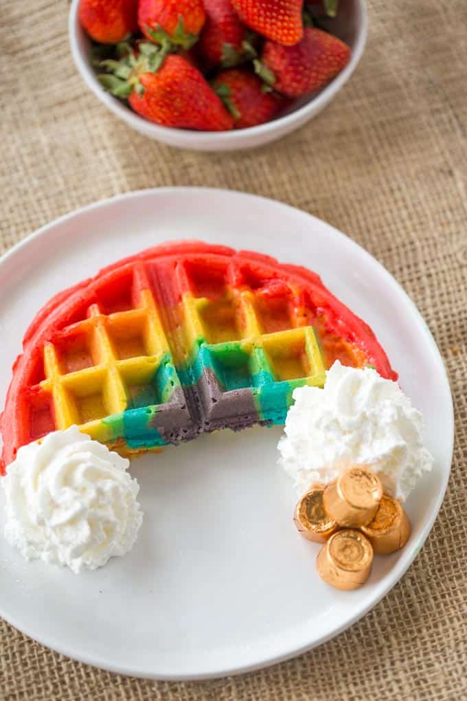 Belgian Rainbow Waffles will make your St. Patrick's Day Breakfast a hit with homemade Belgian waffles turned into beautiful rainbows with a pot o' gold.