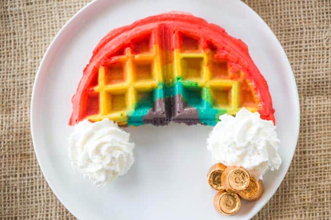 Belgian Rainbow Waffles will make your St. Patrick's Day Breakfast a hit with homemade Belgian waffles turned into beautiful rainbows with a pot o' gold.