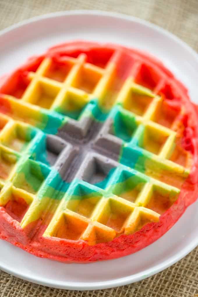 Belgian Rainbow Waffles will make your St. Patrick's Day Breakfast a hit with homemade Belgian waffles turned into beautiful rainbows with a pot o' gold.