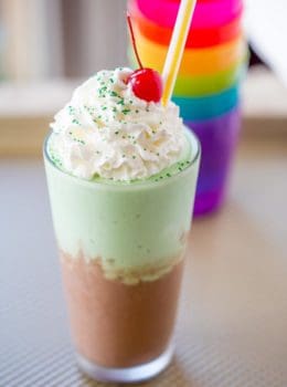 McDonald's Chocolate Shamrock Shake is half classic chocolate shake topped and half Shamrock Shake topped with whipped cream and a chocolate drizzle. The perfect mix of classics for a whole new flavor!
