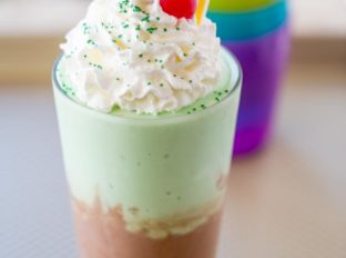 McDonald's Chocolate Shamrock Shake is half classic chocolate shake topped and half Shamrock Shake topped with whipped cream and a chocolate drizzle. The perfect mix of classics for a whole new flavor!