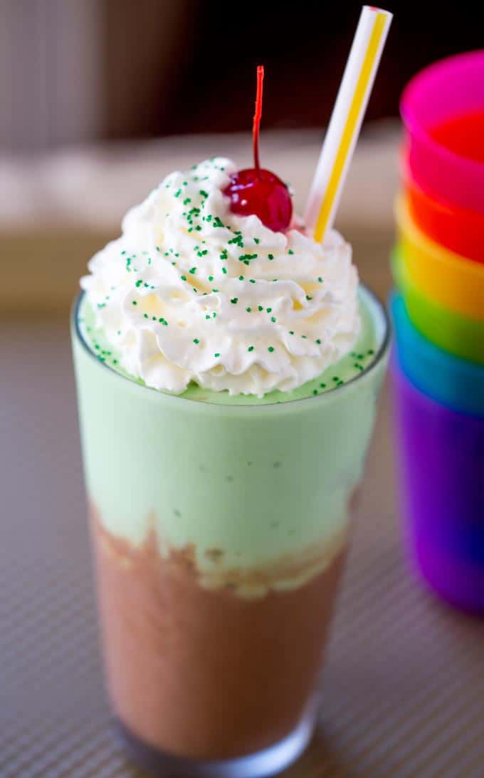 McDonald's Chocolate Shamrock Shake is half classic chocolate shake topped and half Shamrock Shake topped with whipped cream and a chocolate drizzle. The perfect mix of classics for a whole new flavor!
