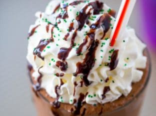 McDonald's Shamrock Chocolate Chip Frappe has a mocha caramel base with mint and chocolate chips blended in for a mint mocha frozen treat you'll love topped with chocolate sauce and whipped cream.
