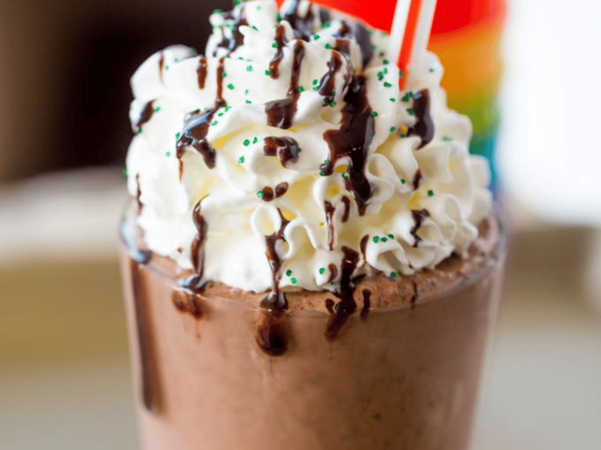 Milkshake with whipped cream and chocolate drizzle