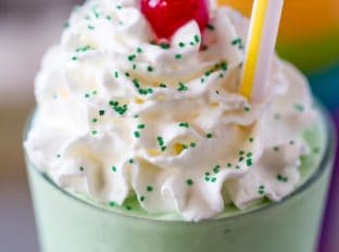 McDonald's Shamrock Shake is the homemade version of the classic St. Patrick's day treat made with vanilla ice cream, mint extract, whipped cream and a cherry.