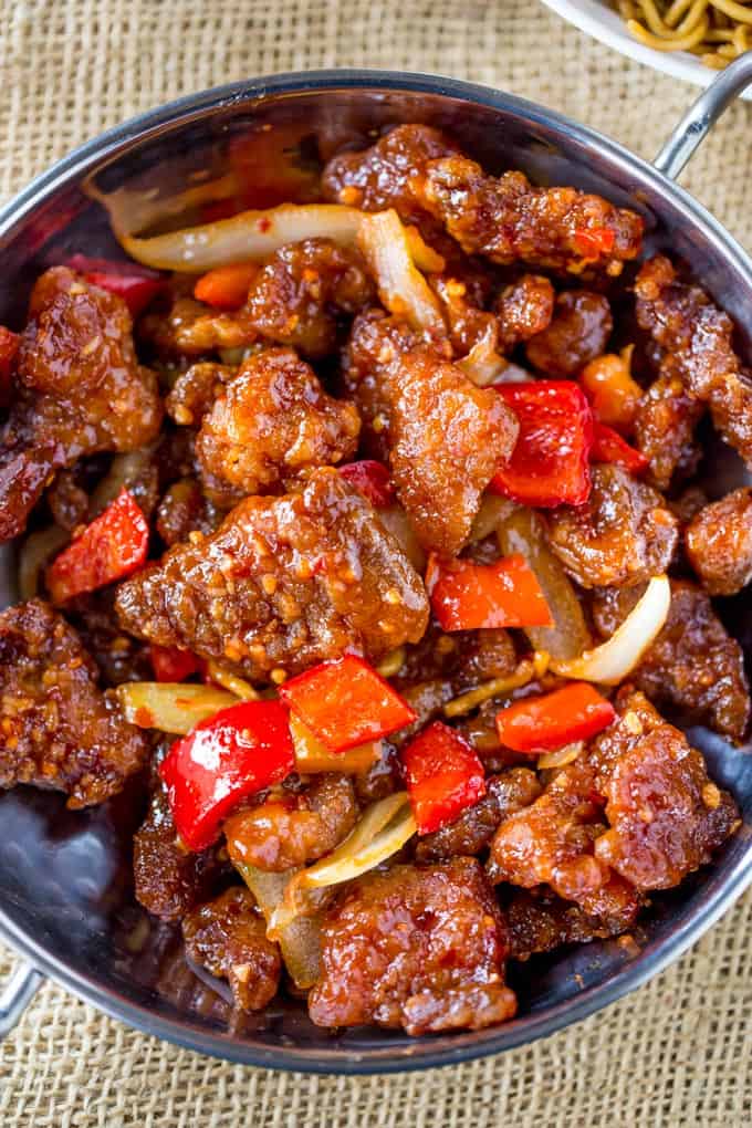 Panda Express Beijing Beef is an awesome copycat of the original with crispy strips of marinated beef, bell peppers and sliced onions, tossed in the wok with a tangy sweet and spicy sauce.