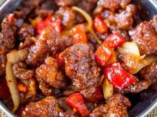 Panda Express Beijing Beef is an awesome copycat of the original with crispy strips of marinated beef, bell peppers and sliced onions, tossed in the wok with a tangy sweet and spicy sauce.
