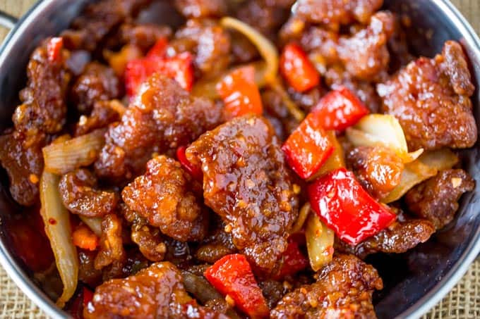 Panda Express Beijing Beef is an awesome copycat of the original with crispy strips of marinated beef, bell peppers and sliced onions, tossed in the wok with a tangy sweet and spicy sauce.