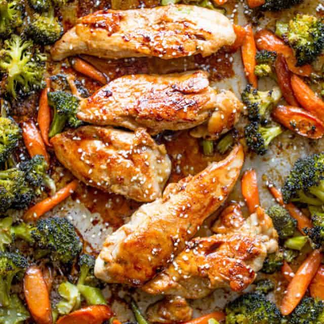 Sheet Pan Korean Chicken and Vegetables are a delicious and easy weeknight meal that cooks in one pan and makes crispy tender vegetables and moist sweet and garlicky chicken.