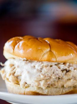 Slow Cooker Chicken Caesar Sandwiches made with easy homemade caesar dressing, Parmesan Cheese and a buttery hamburger bun.