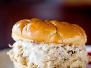 Slow Cooker Chicken Caesar Sandwiches made with easy homemade caesar dressing, Parmesan Cheese and a buttery hamburger bun.