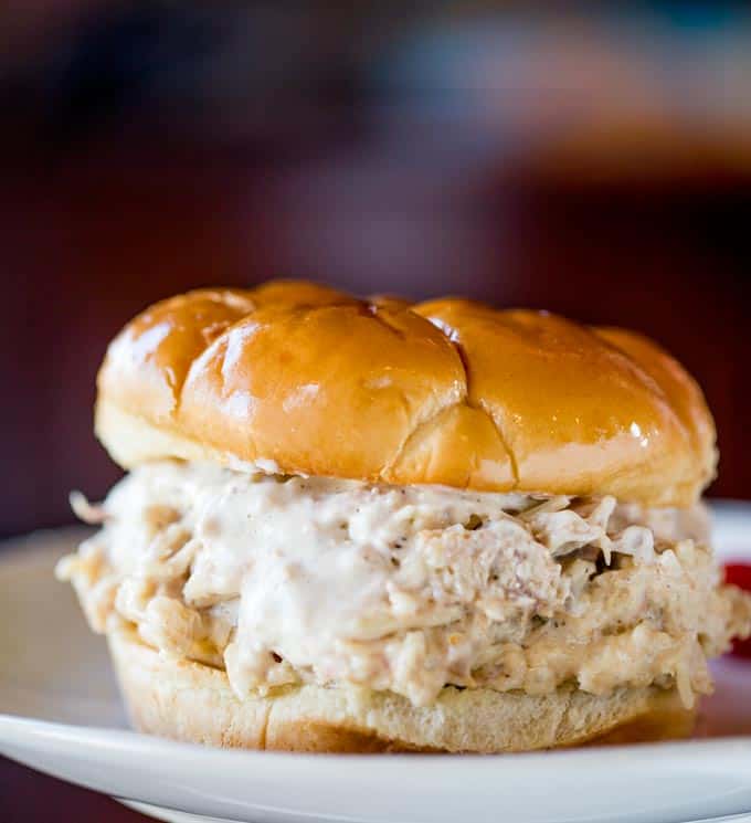 Slow Cooker Chicken Caesar Sandwiches made with easy homemade caesar dressing, Parmesan Cheese and a buttery hamburger bun.