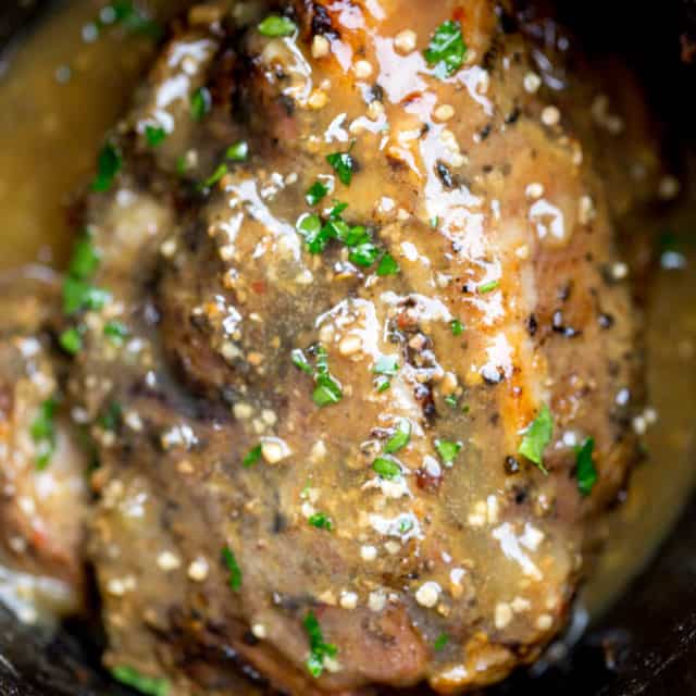 Slow Cooker Cuban Mojo Pork made with citrus, garlic, oregano and cumin takes almost no prep time and makes a fantastic, flavorful meal your family will love any night of the week!