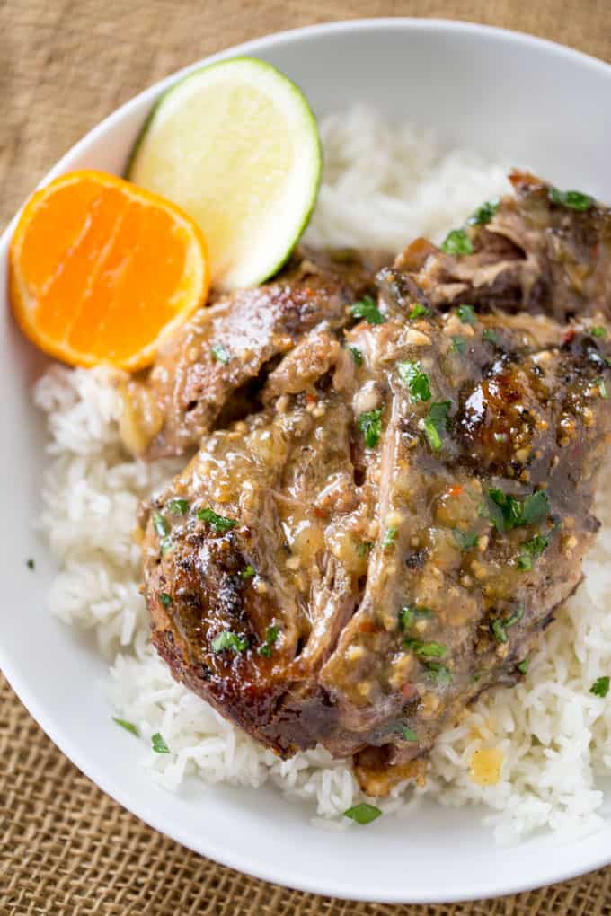 Slow Cooker Cuban Mojo Pork made with citrus, garlic, oregano and cumin takes almost no prep time and makes a fantastic, flavorful meal your family will love any night of the week!