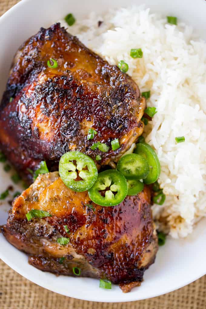 Jerk Chicken served over rice with sliced jalepenos